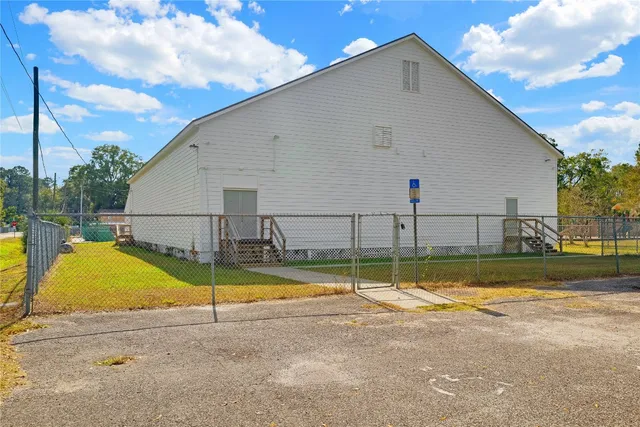 a view of a backyard with swimming pool