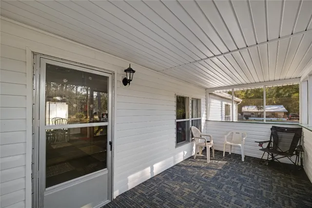 a patio with table and chairs