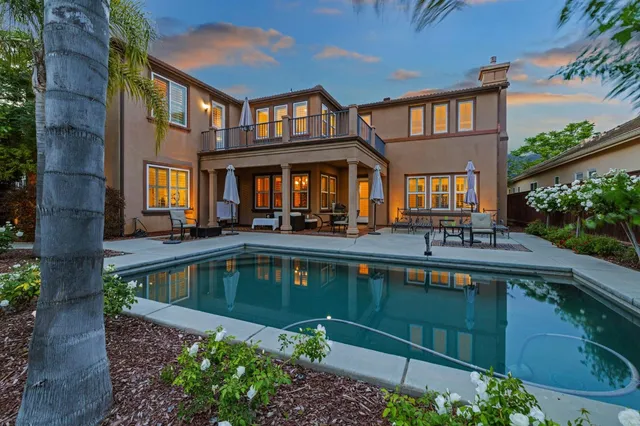 a front view of a house with swimming pool