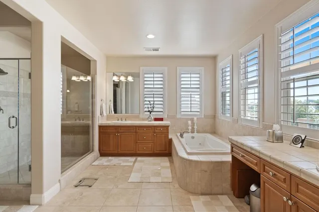 a front view of a house with a yard and outdoor seating