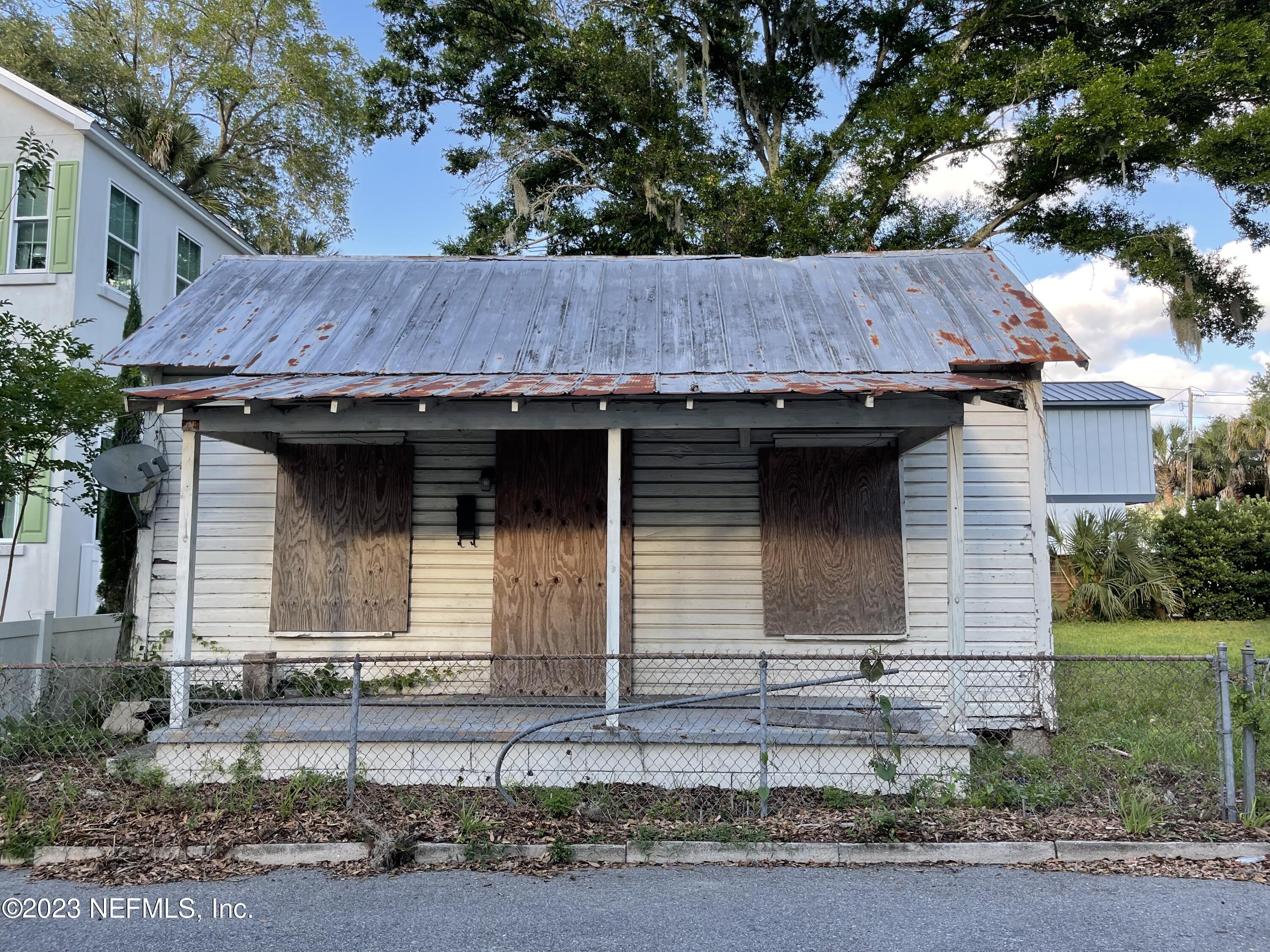 93 Oneida Street St. Augustine, FL 32084 - Photo 5 of 8 a view of a house with a yard