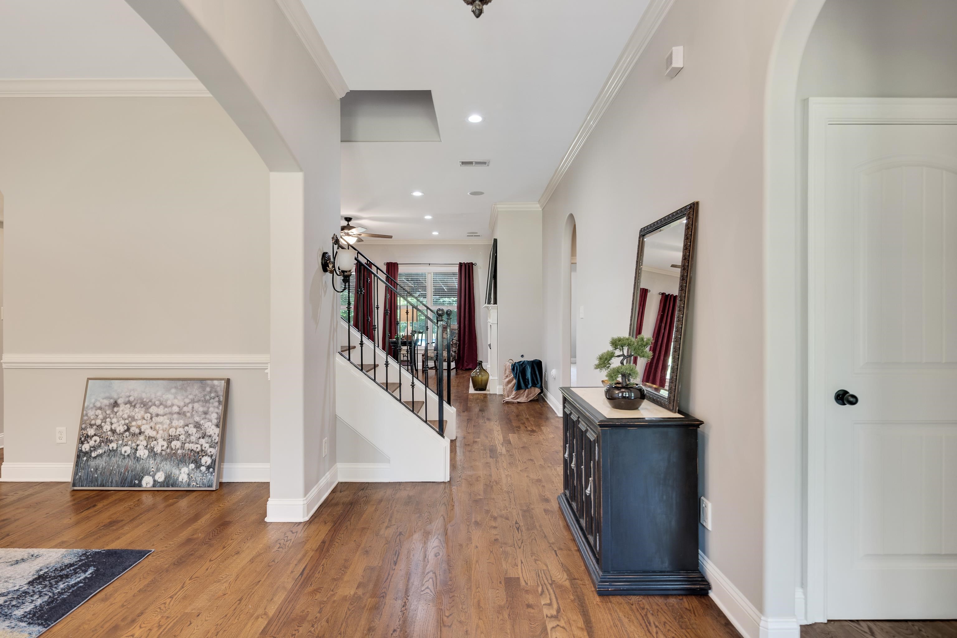 9028 Osborntown Road Arlington, TN 38002 - Photo 6 of 40 a view of a hallway with workspace and wooden floor