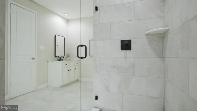 a bathroom with a shower and a sink