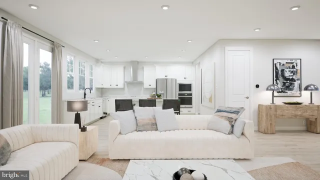 a living room with furniture white walls and white walls