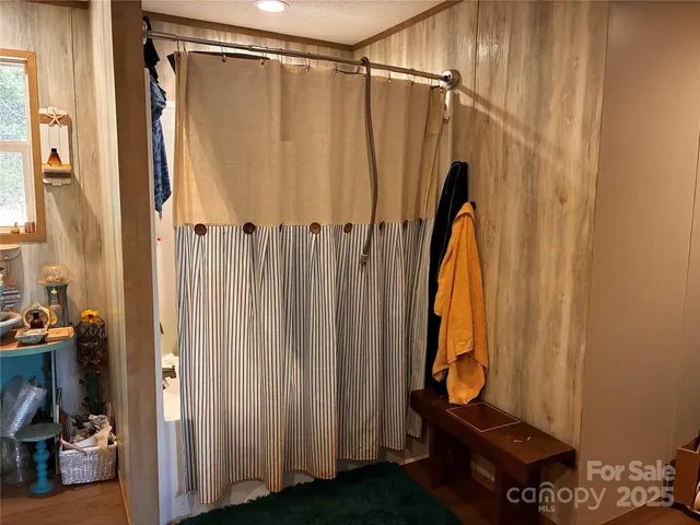 a bathroom with a shower and a tub