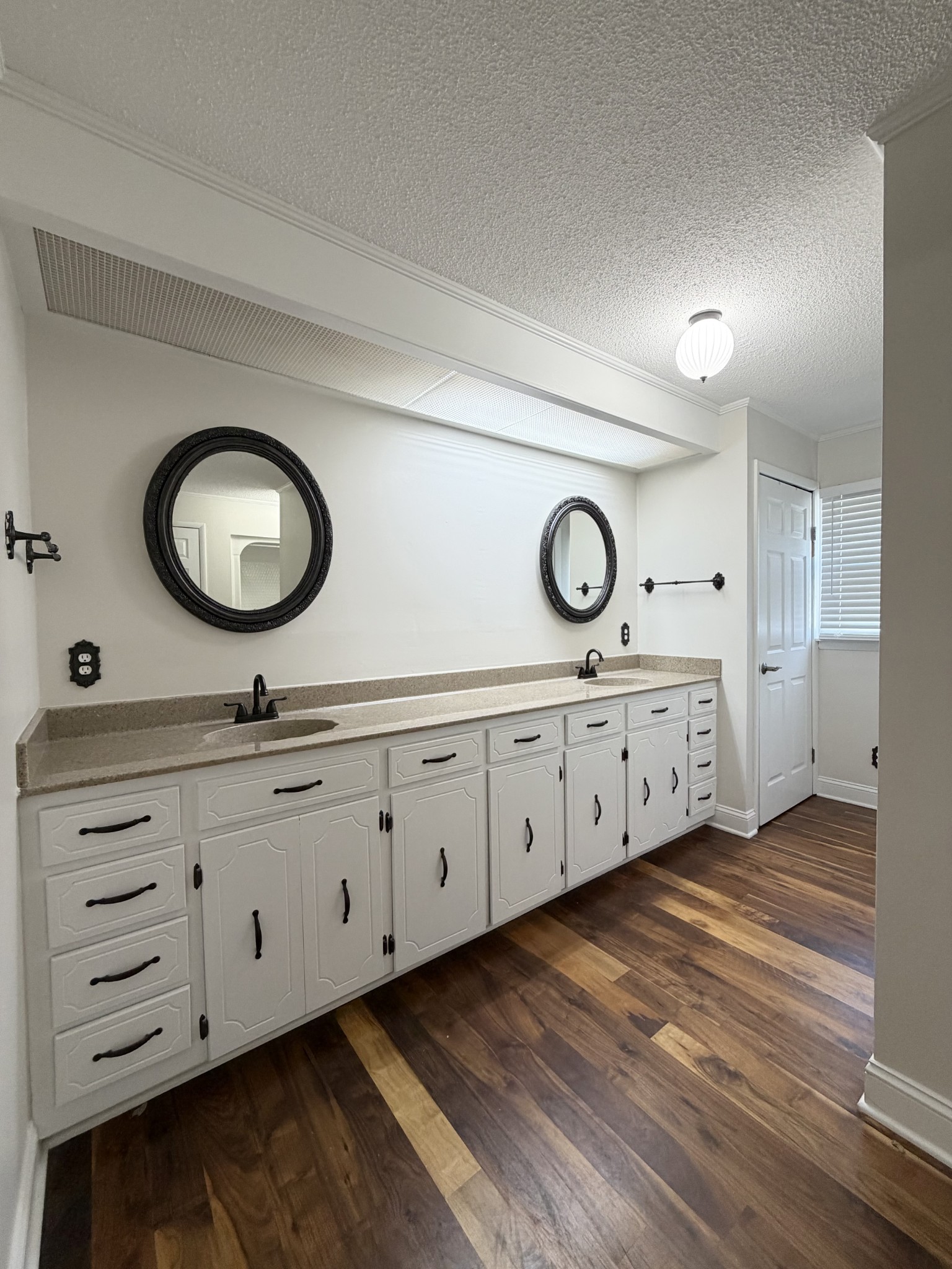 422 7th Street Lawrenceburg, TN 38464 - Photo 15 of 25 a bathroom with double vanity sink and a mirror