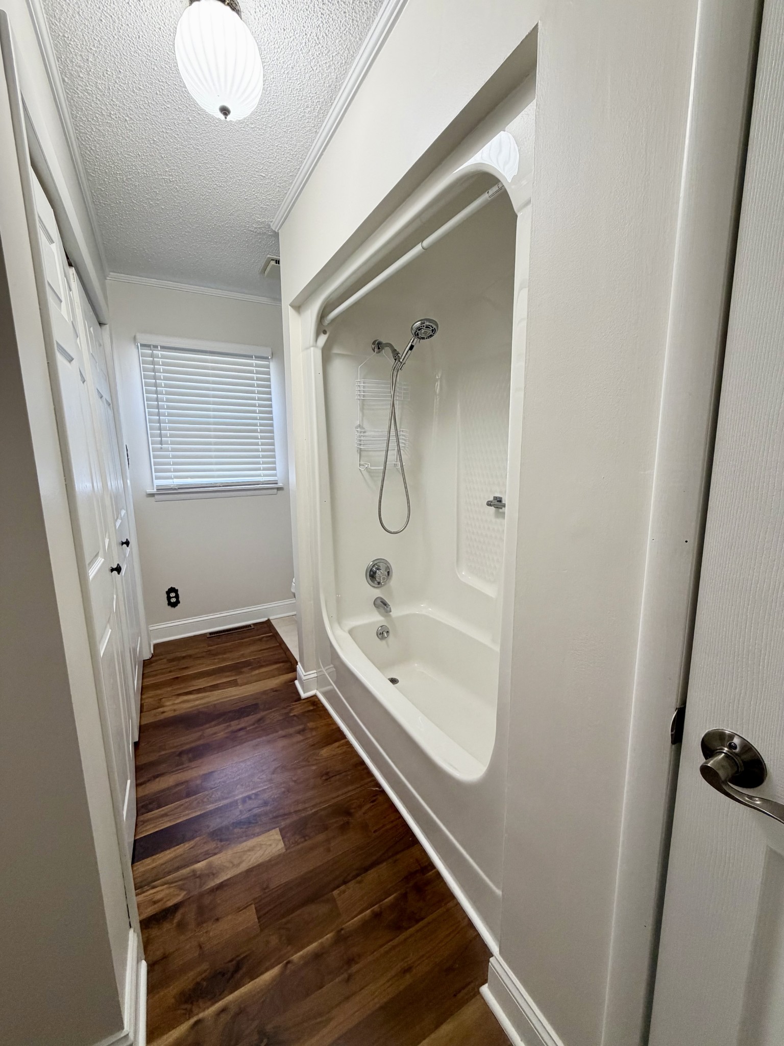 422 7th Street Lawrenceburg, TN 38464 - Photo 17 of 25 a bathroom with a bathtub and a shower