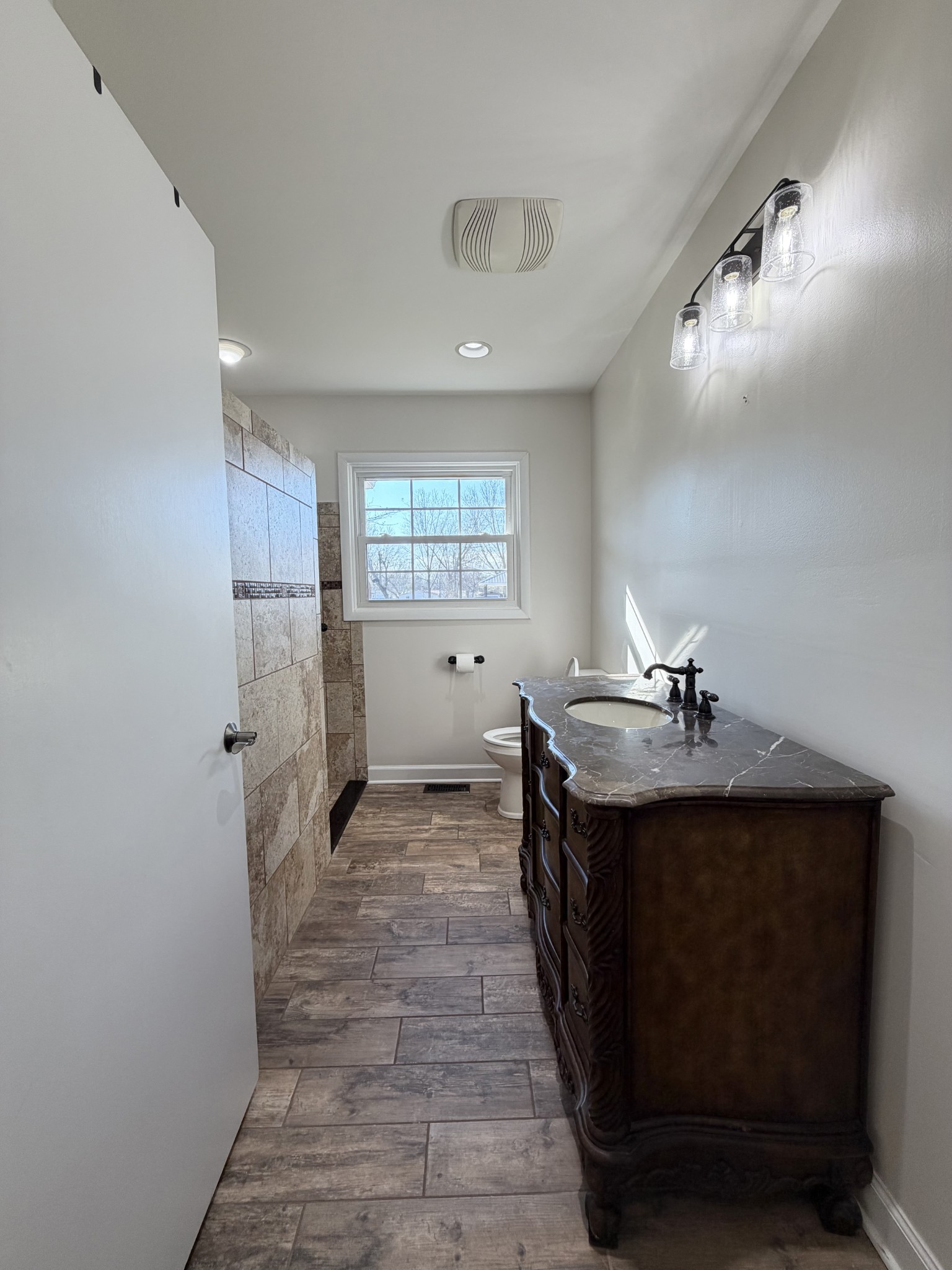 422 7th Street Lawrenceburg, TN 38464 - Photo 20 of 25 a view of a kitchen with a sink and refrigerator