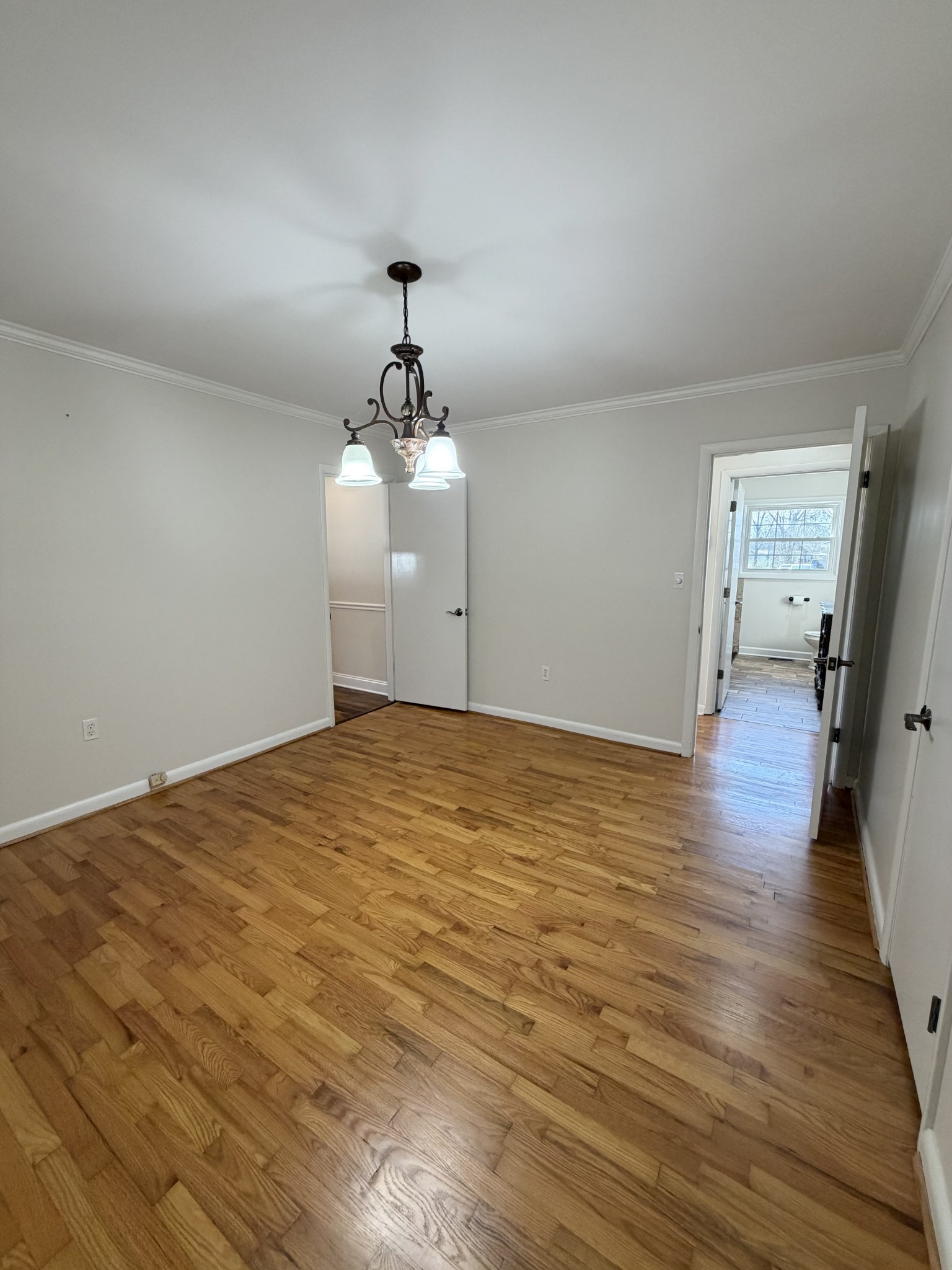 422 7th Street Lawrenceburg, TN 38464 - Photo 22 of 25 a view of a room with wooden floor and ceiling fan