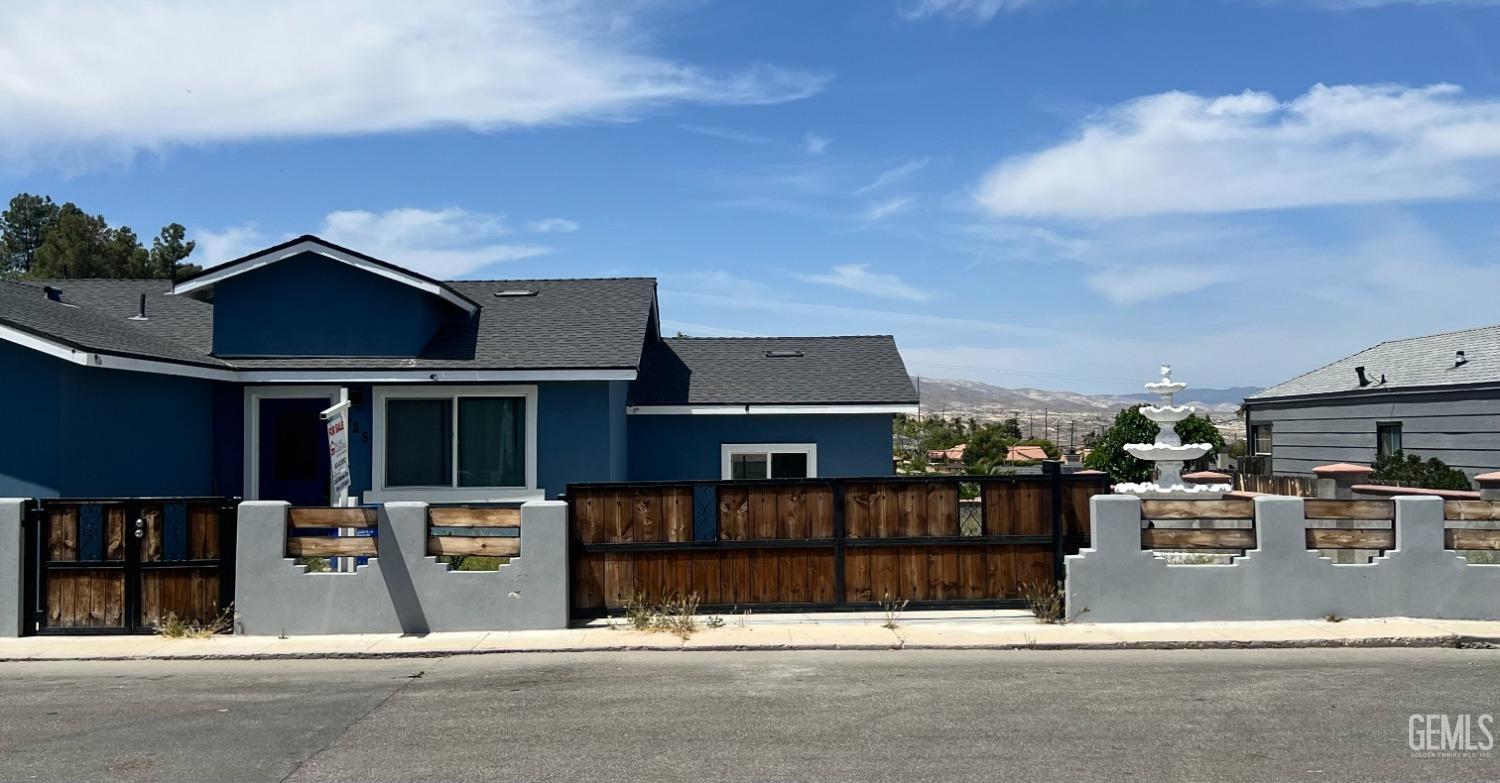 Undisclosed Address Taft, CA 93268 - Photo 9 of 10 a view of a house with a garage