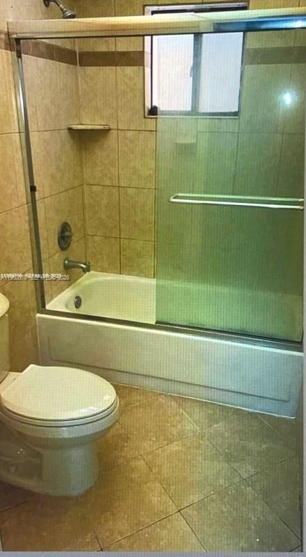 8420 Southwest 133rd Avenue Road, Unit 309 Miami, FL 33183 - Photo 13 of 22 a bathroom with a toilet and a shower
