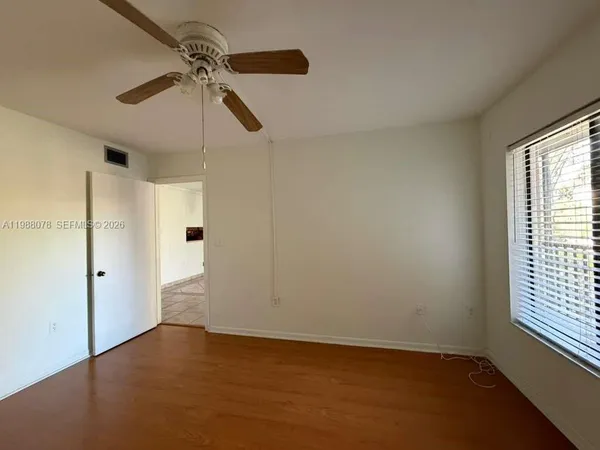 a view of an empty room with a window