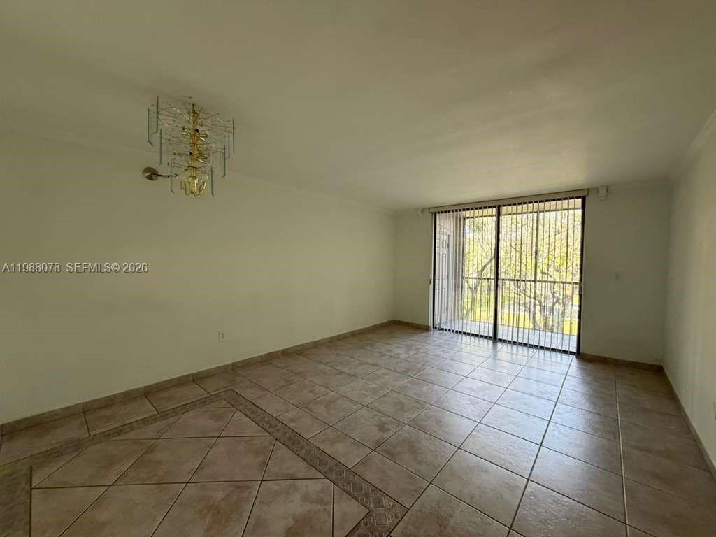 8420 Southwest 133rd Avenue Road, Unit 309 Miami, FL 33183 - Photo 18 of 22 a view of an empty room with a window