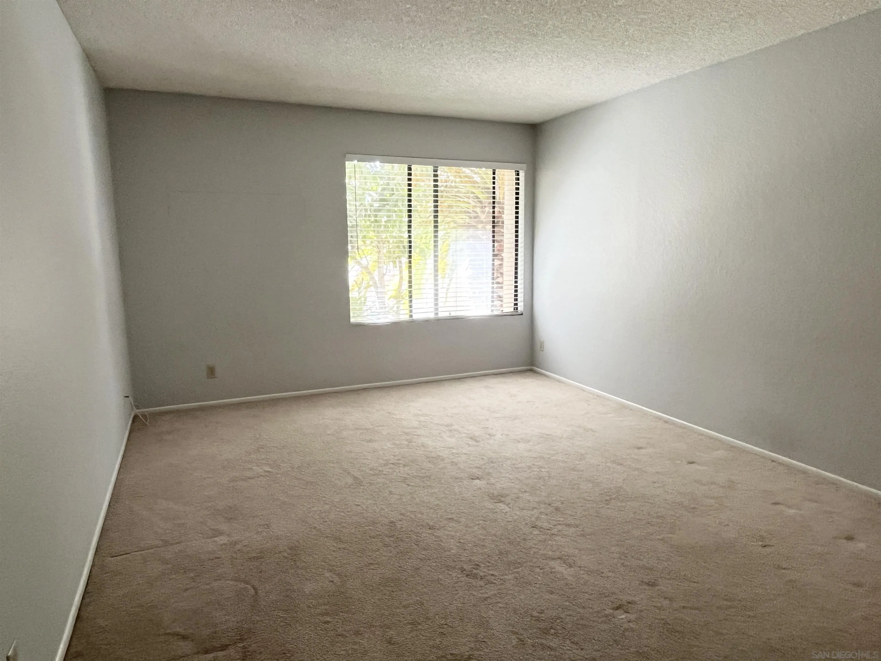 8365 Westmore Road, Unit 20 San Diego, CA 92126 - Photo 15 of 29 an empty room with a empty space and windows