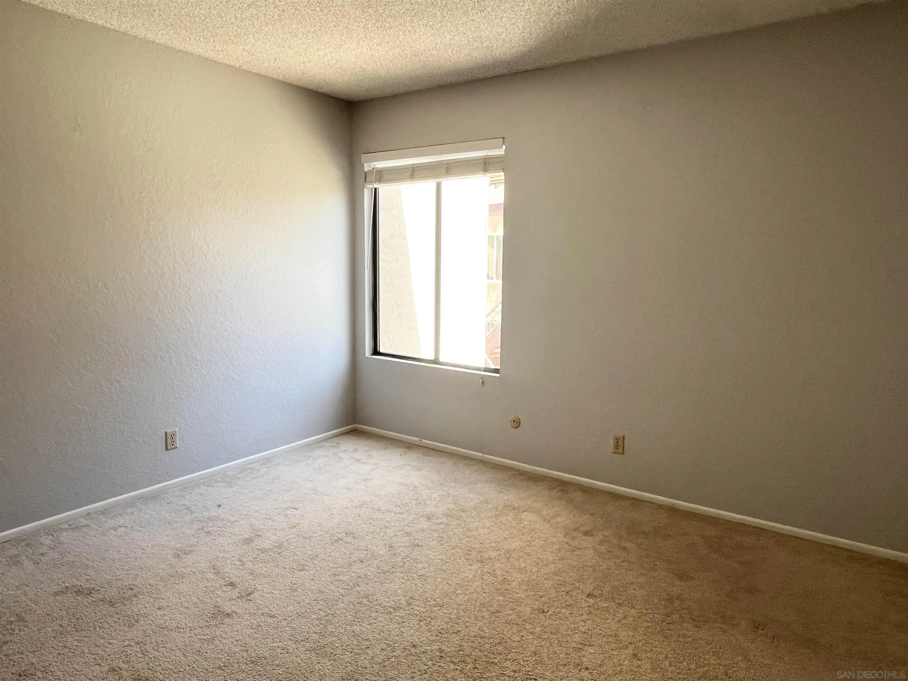 8365 Westmore Road, Unit 20 San Diego, CA 92126 - Photo 18 of 29 an empty room with a window