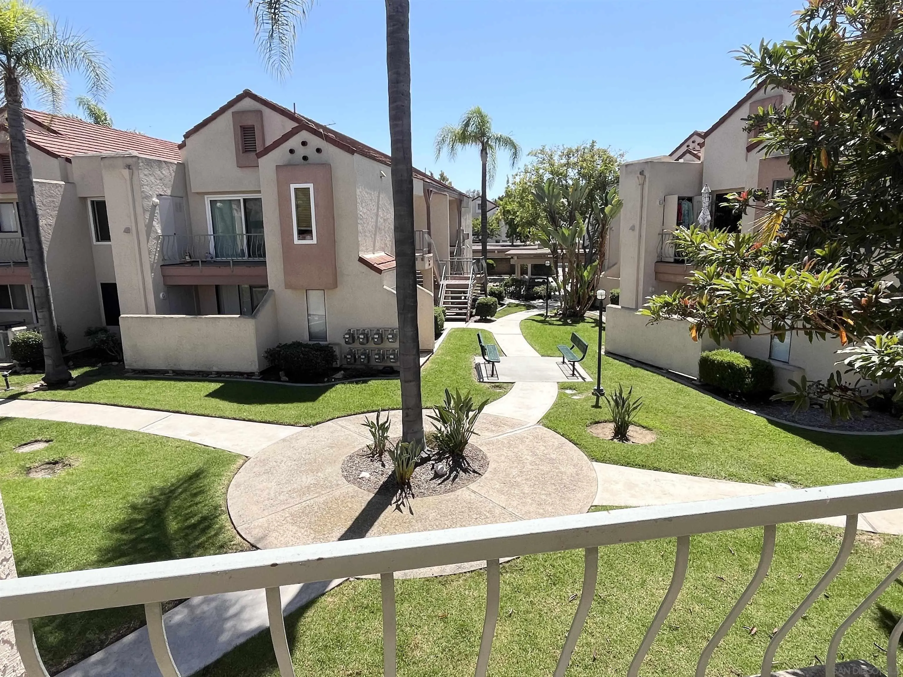 8365 Westmore Road, Unit 20 San Diego, CA 92126 - Photo 26 of 29 a front view of a house with garden