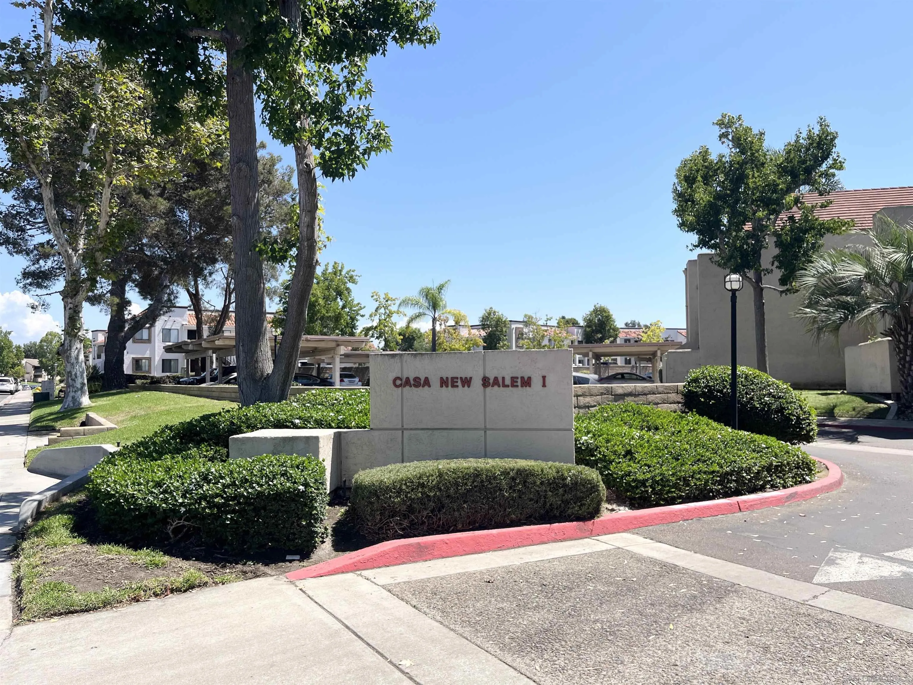 8365 Westmore Road, Unit 20 San Diego, CA 92126 - Photo 29 of 29 a view of a garden with a fountain and a big trees