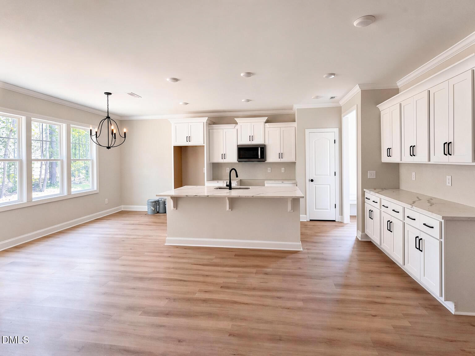 10440 Stallings Road Spring Hope, NC 27882 - Photo 4 of 15 a large kitchen with stainless steel appliances kitchen island a large counter top and a wooden floors