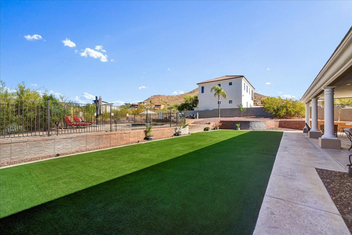 412 East Yearling Road Phoenix, AZ 85085 - Photo 35 of 51 a view of green field with house in the background