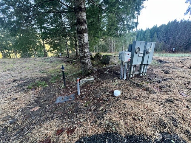 9999 Mallard Cove Road Port Angeles, WA 98363 - Photo 5 of 15 a view of a backyard with chairs and a table