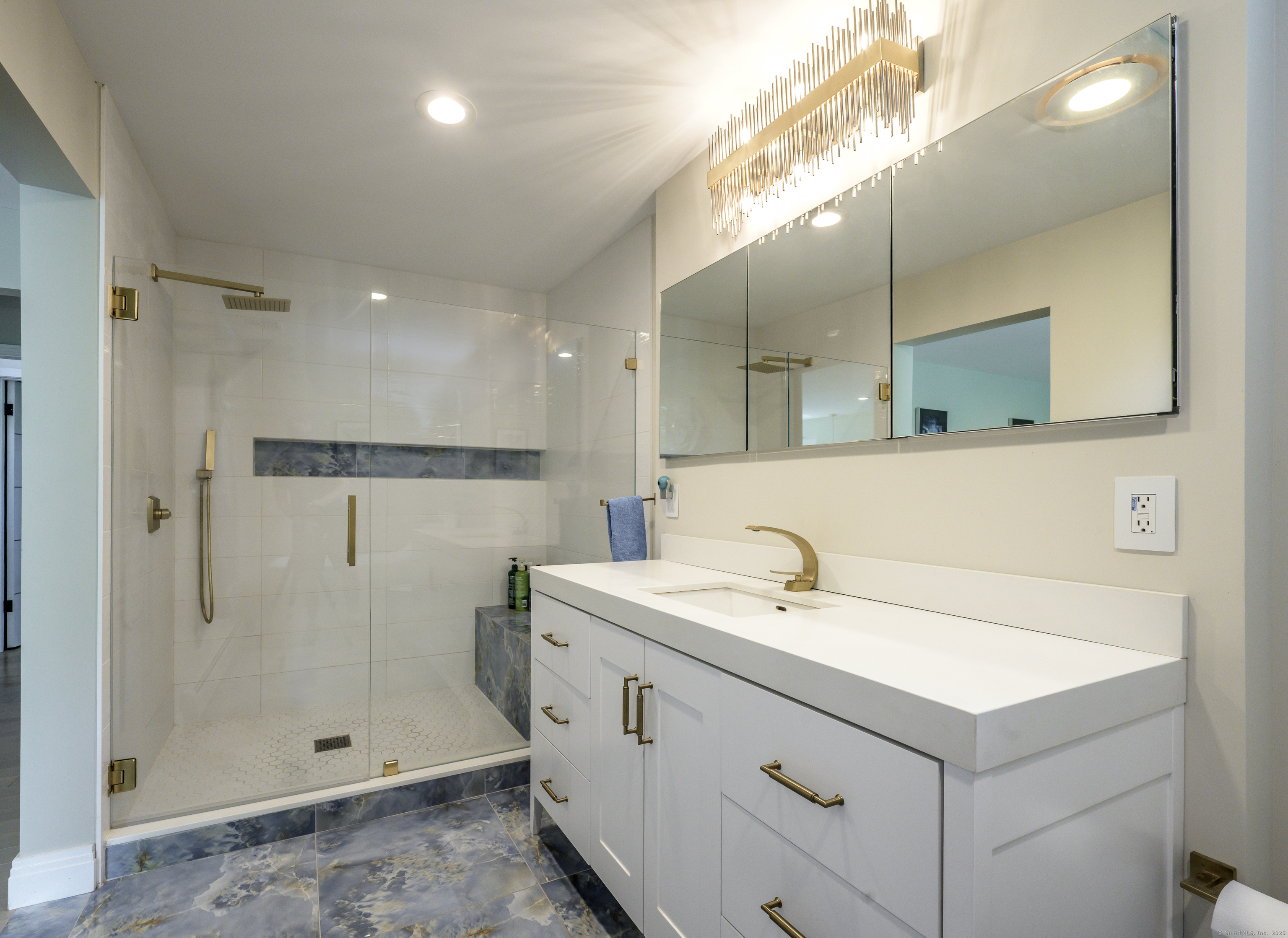 35 Kirk Road Sharon, CT 06796 - Photo 38 of 40 a bathroom with a sink a mirror and shower