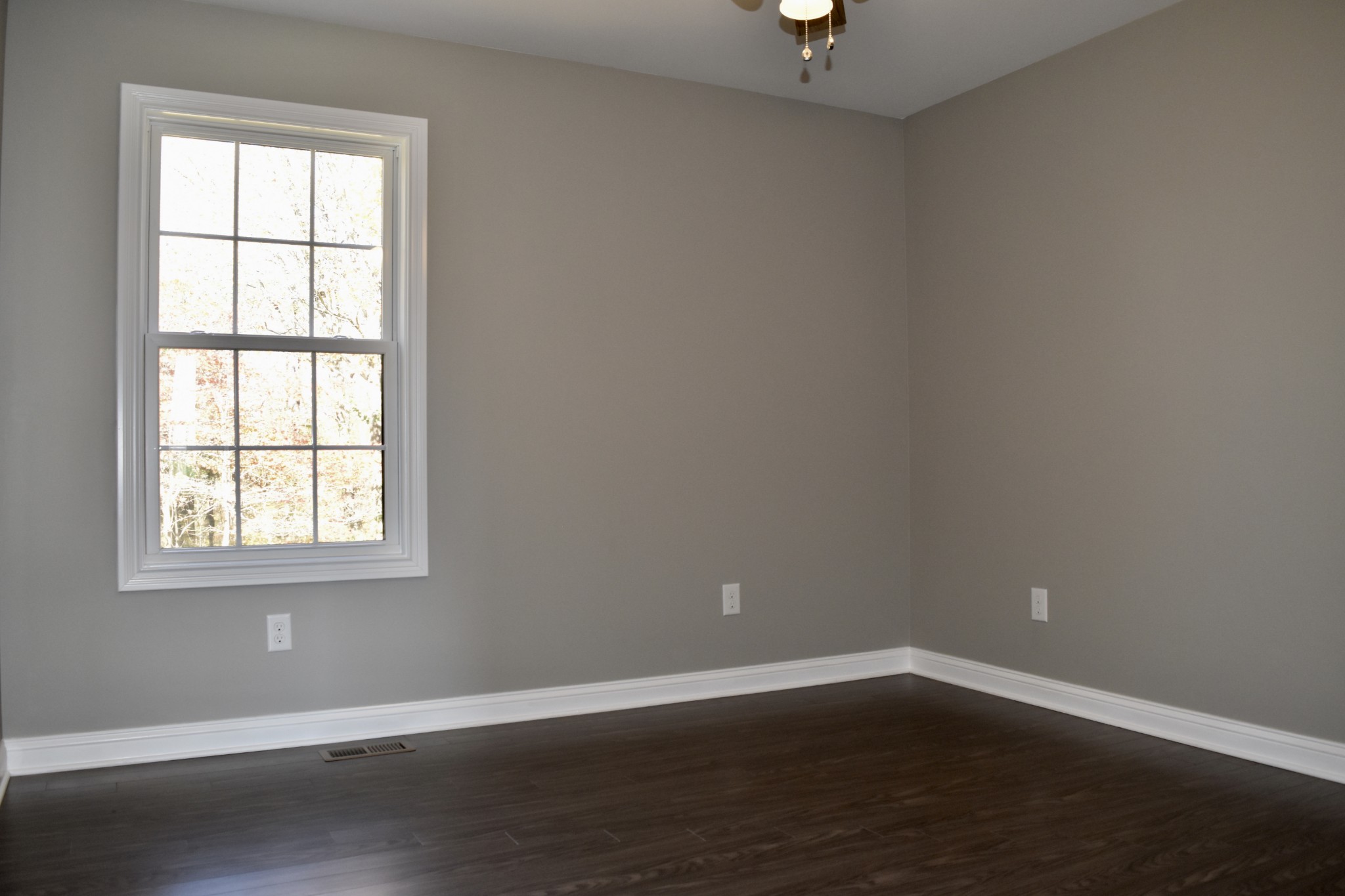 145 Carter Road East Portland, TN 37148 - Photo 14 of 24 an empty room with wooden floor and windows