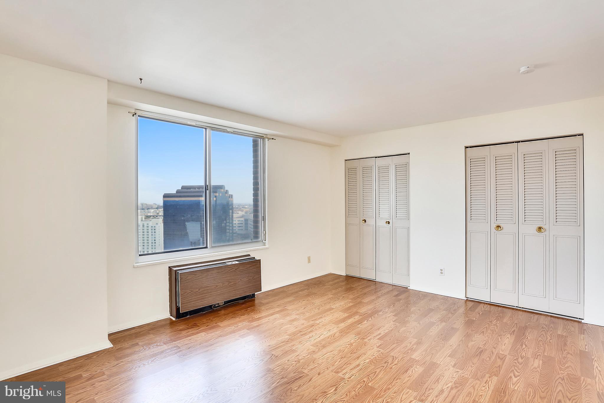 9701 Fields Road, Unit 1604 Gaithersburg, MD 20878 - Photo 15 of 30 wooden floor in an empty room with a window