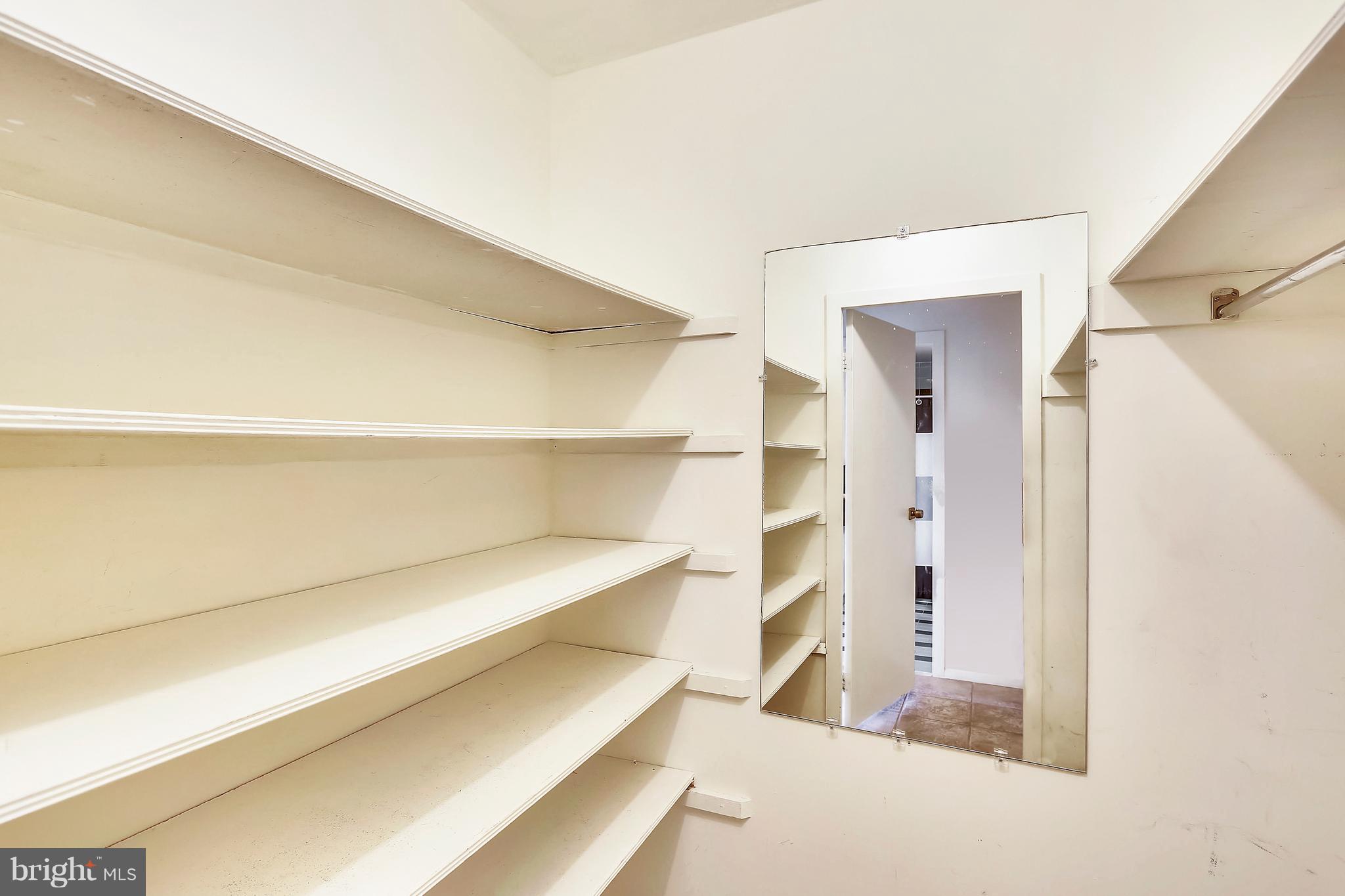 9701 Fields Road, Unit 1604 Gaithersburg, MD 20878 - Photo 17 of 30 a view of walk in closet with empty racks