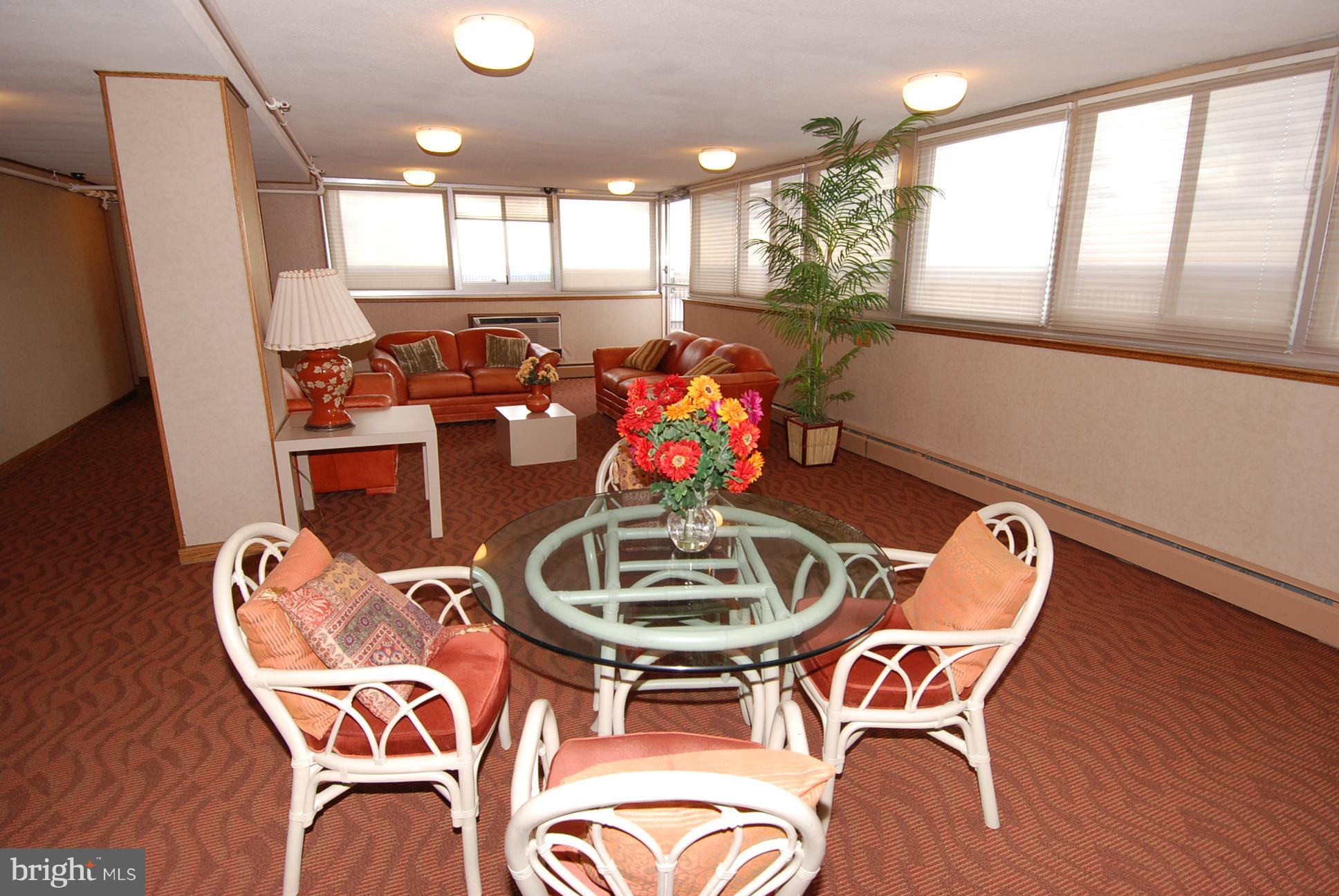 9701 Fields Road, Unit 1604 Gaithersburg, MD 20878 - Photo 24 of 30 a view of a dining room with furniture and wooden floor