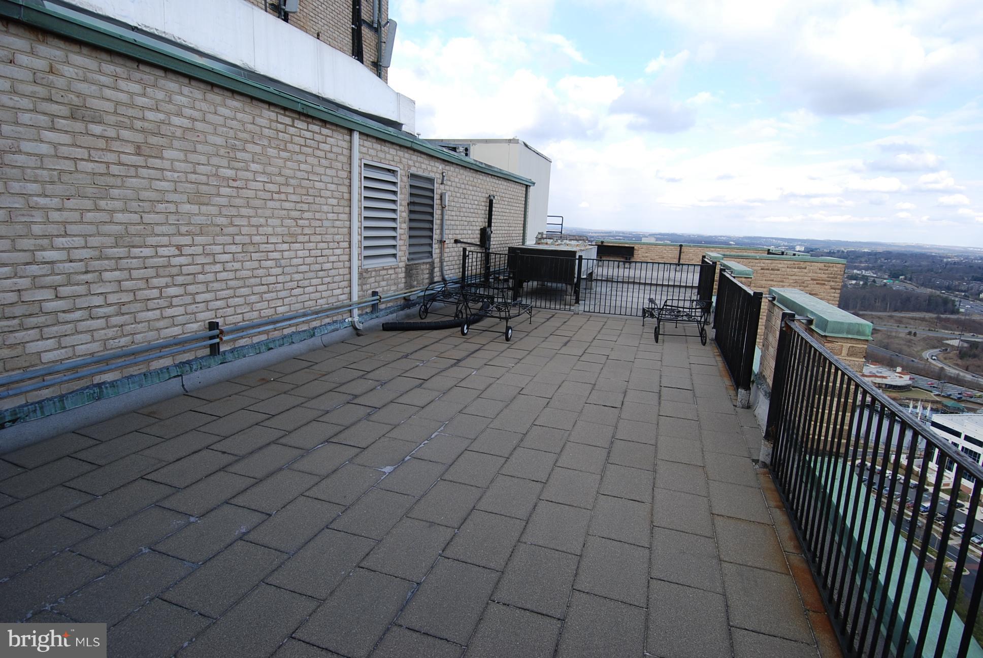 9701 Fields Road, Unit 1604 Gaithersburg, MD 20878 - Photo 25 of 30 a view of a terrace with lawn chairs