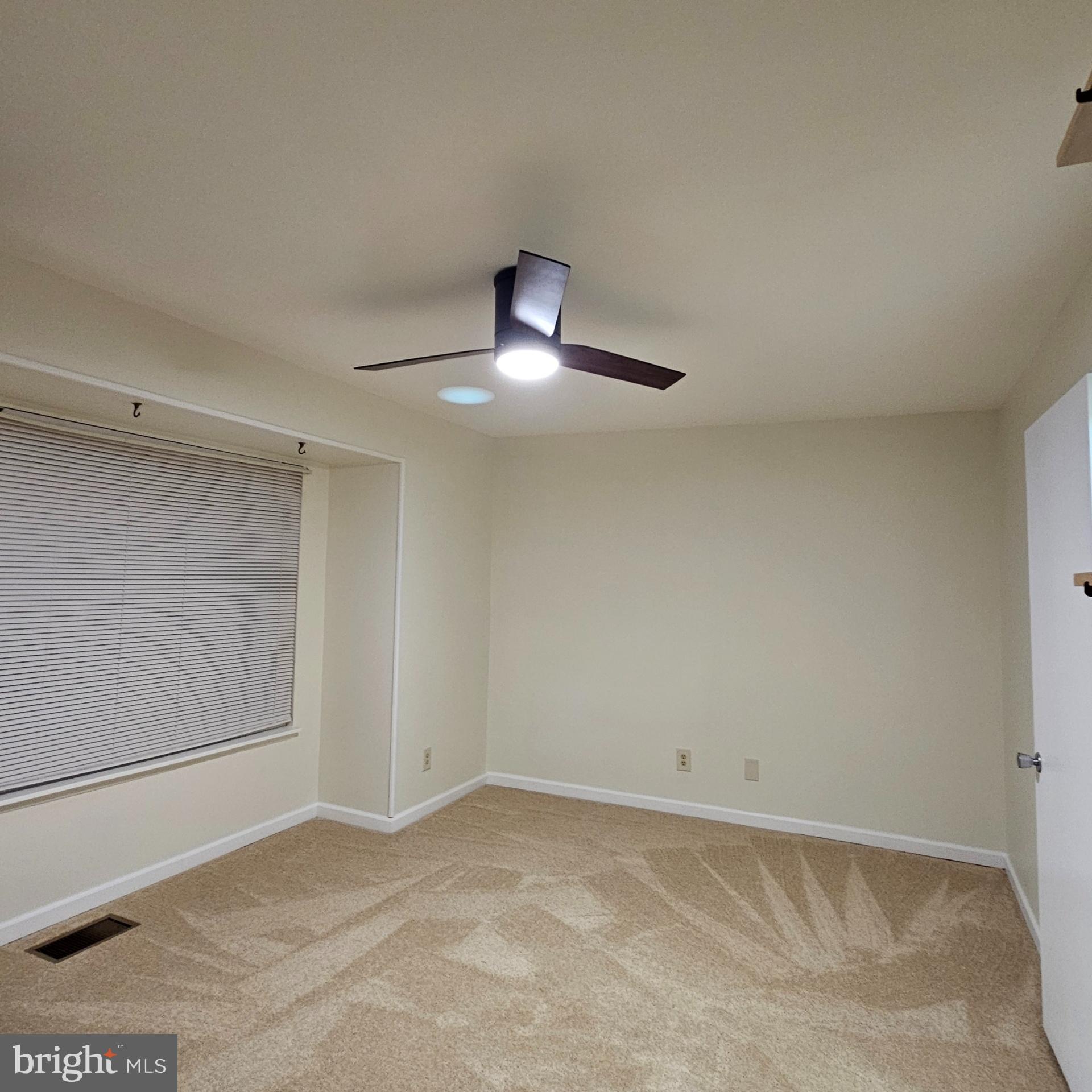 1808 Westwind Way, Unit 79 McLean, VA 22102 - Photo 14 of 24 a view of an empty room with a fan