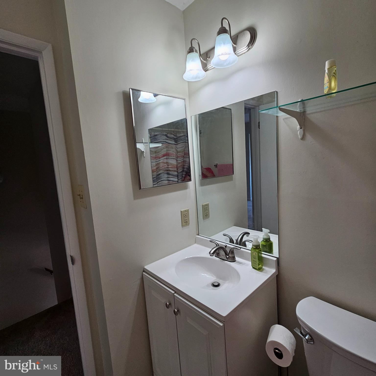 1808 Westwind Way, Unit 79 McLean, VA 22102 - Photo 19 of 24 a bathroom with a sink a toilet and mirror