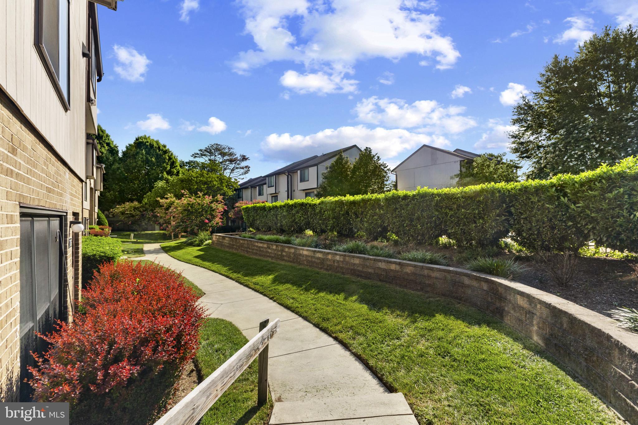 1808 Westwind Way, Unit 79 McLean, VA 22102 - Photo 5 of 24 a view of a garden with mountains
