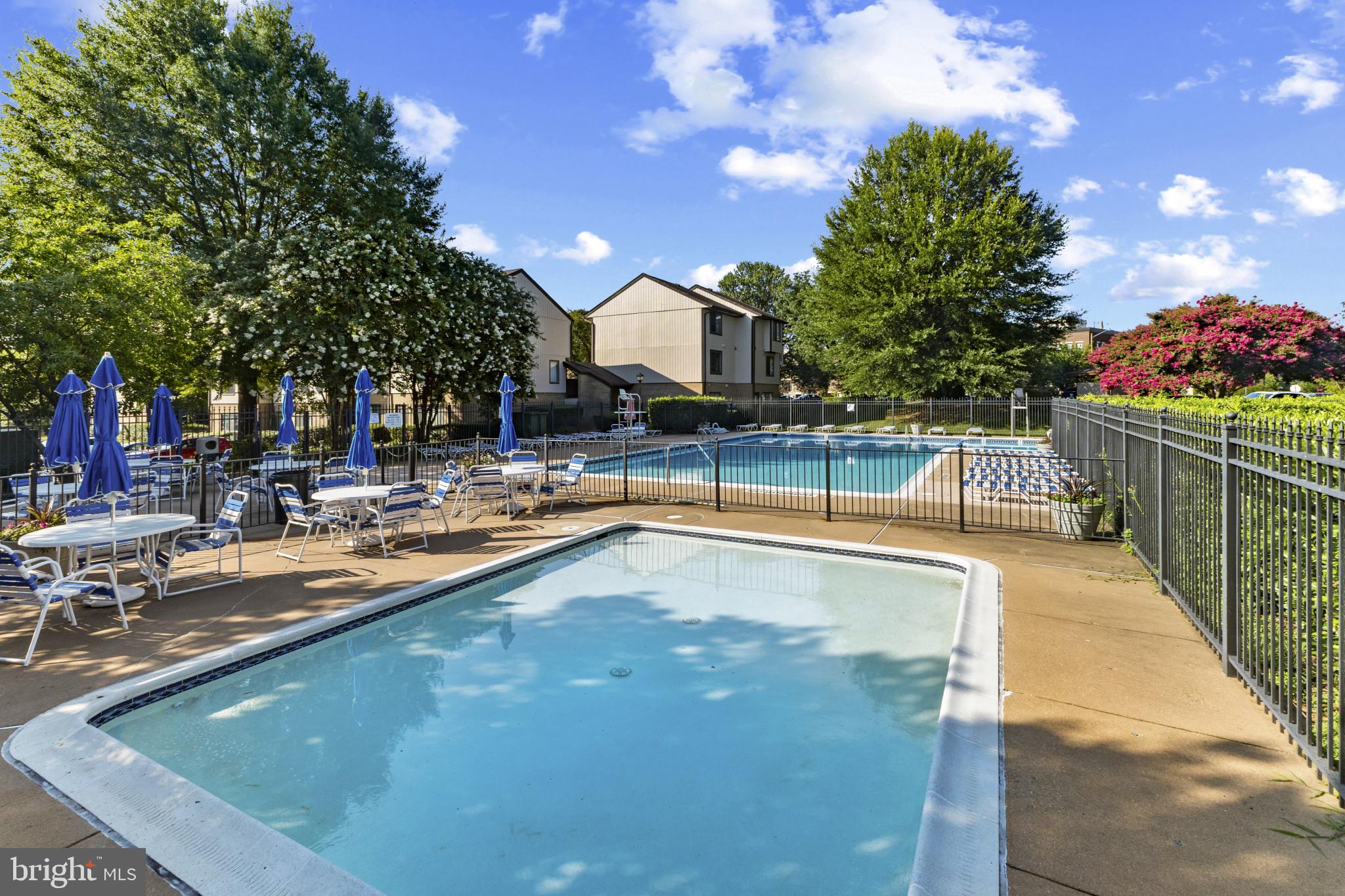 1808 Westwind Way, Unit 79 McLean, VA 22102 - Photo 6 of 24 a view of a swimming pool with outdoor seating