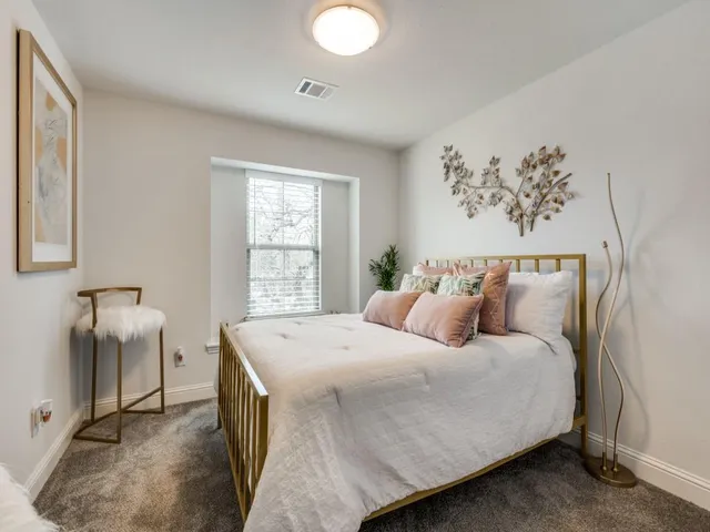 a spacious bathroom with a double vanity sink toilet and shower
