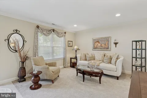 a bathroom with a toilet mirror vanity and vanity