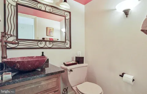 a spacious bedroom with a bed and a fireplace