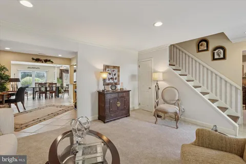 a bedroom with furniture and a large window