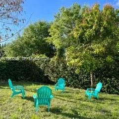 a green field with lots of bushes