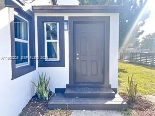 a view of a entryway door front of house