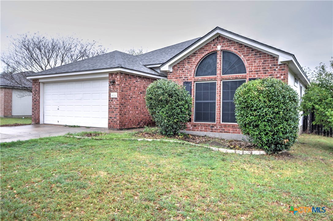 8624 Hogan Road Temple, TX 76502 - Photo 1 of 1 a front view of a house with garden