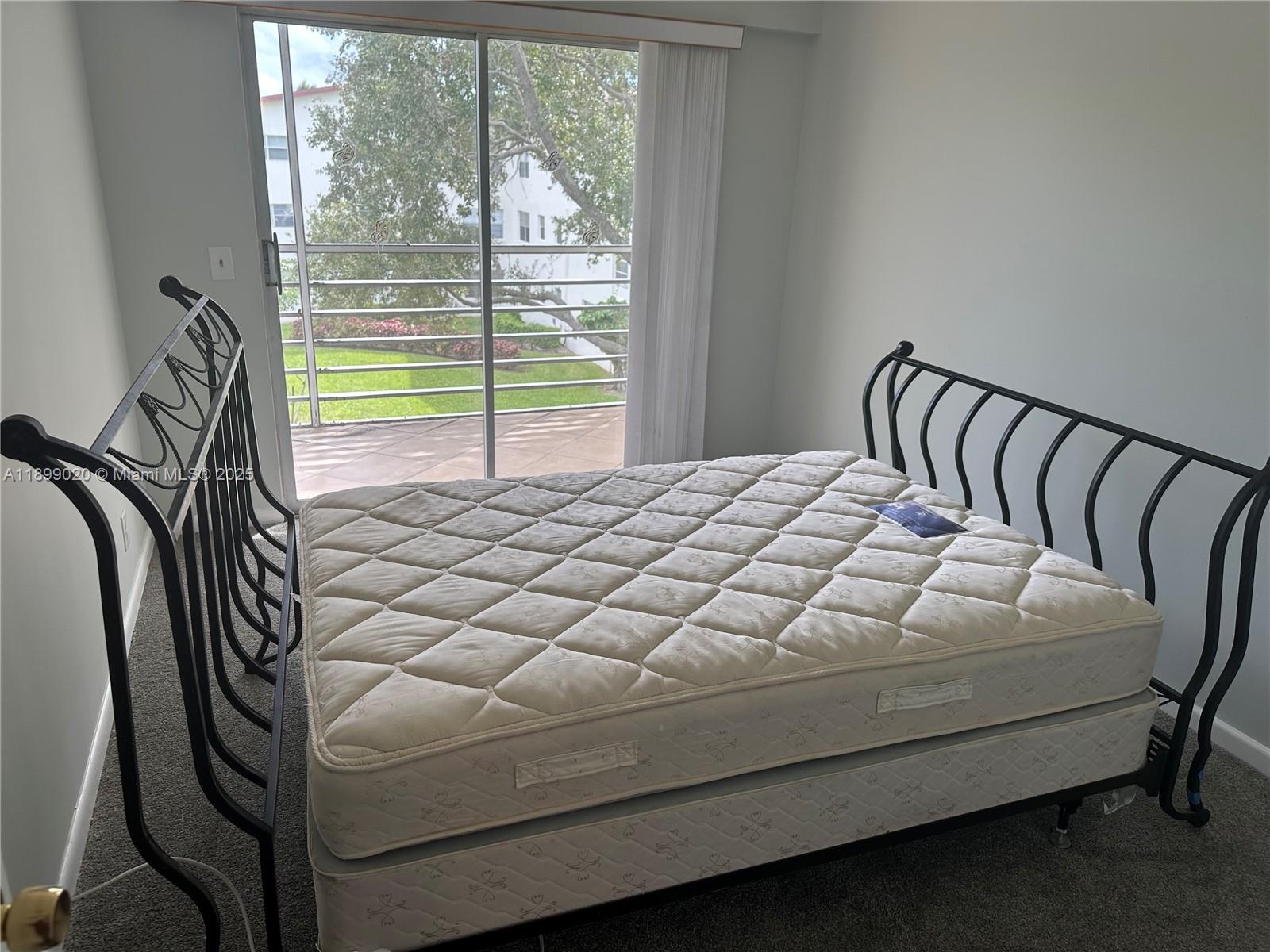 365 Brighton I, Unit 365 Boca Raton, FL 33434 - Photo 7 of 21 a bedroom with a bed and a window