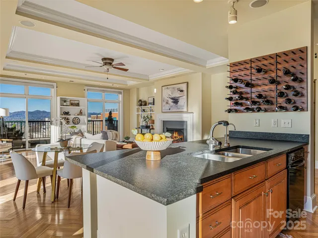 a kitchen with stainless steel appliances granite countertop a sink and cabinets
