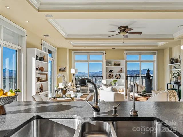 a kitchen with a sink a counter and cabinets