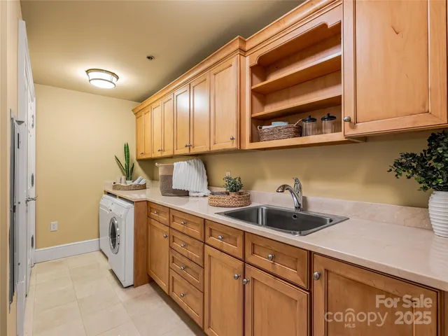 a kitchen with a sink and cabinets