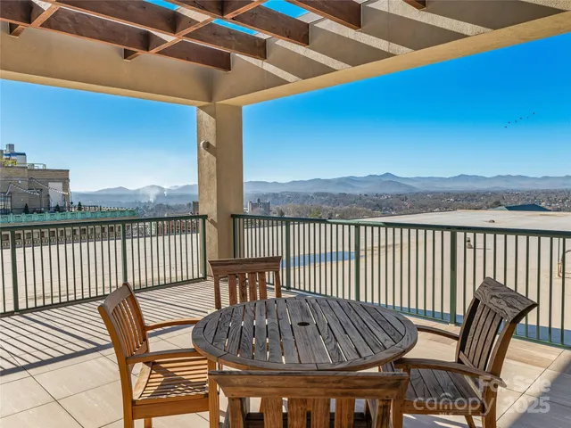 a view of a balcony with furniture