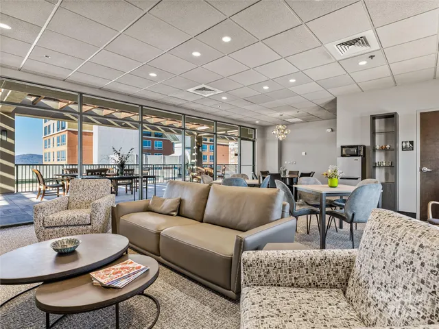 a living room with furniture and a table