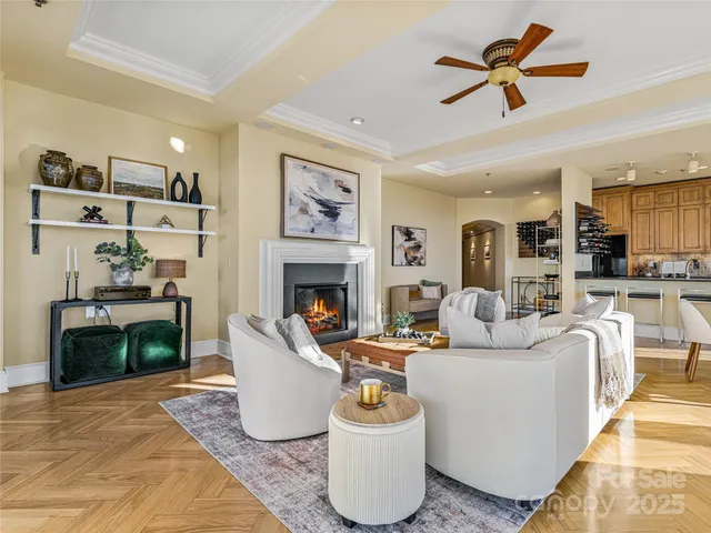a living room with furniture and a fireplace