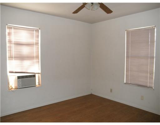 1414 Cook Odem, TX 78370 - Photo 4 of 5 an empty room with a window
