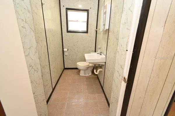 a bathroom with a sink and a toilet